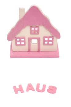 Pink house on white background in portrait format