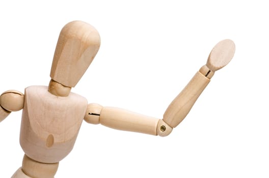 White insulated figure made of wood does raise his arm and hand in greeting