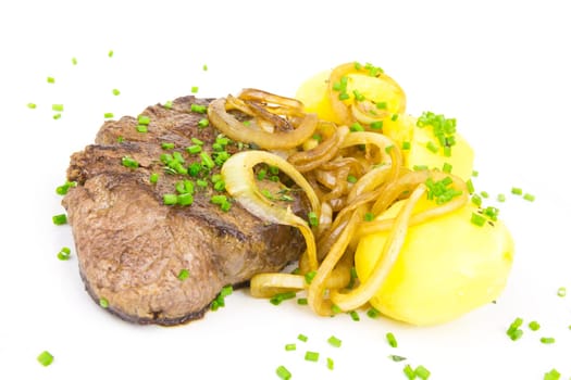Juicy steak with potatoes and onions