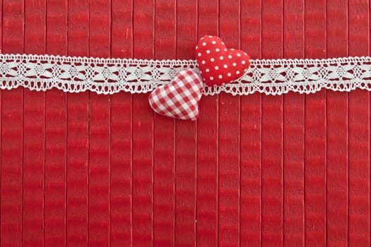 Red background with lace border and small red hearts