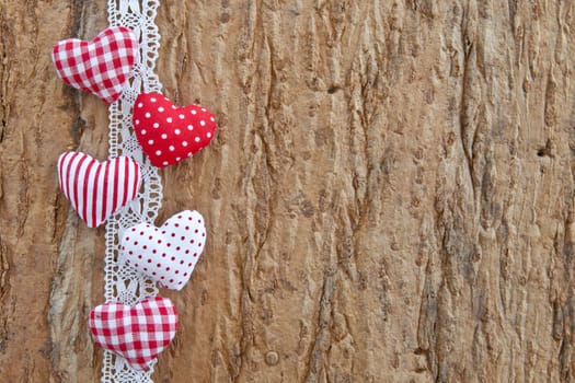 Oak bark background with small red hearts