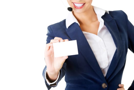 Smiling customer service representative with headset holding a blank empty businesscard. Isolated on white background.