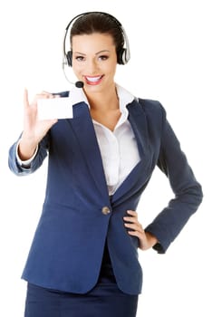 Smiling customer service representative with headset holding a blank empty businesscard. Isolated on white background.