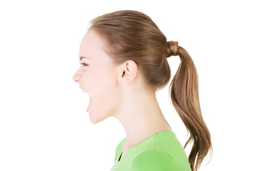 Young casual woman screaming with anger, isolated on white
