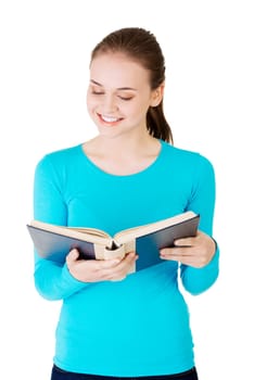 Young woman reading an old book, isolated on white