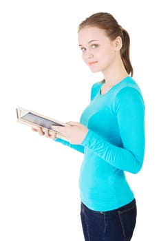 Young woman reading an old book, isolated on white