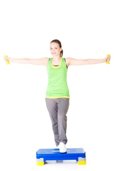 Fitness girl is working out with stepper , isolated on white background