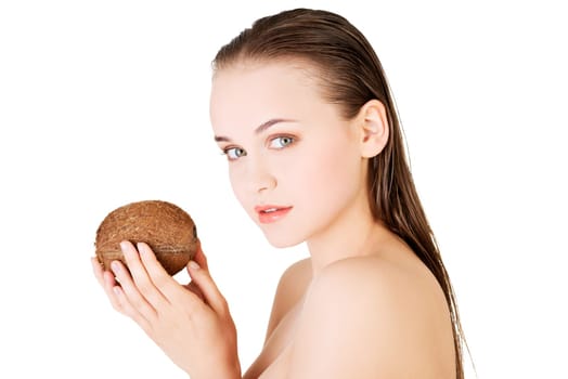 Beautiful woman with coconut in hands over white background