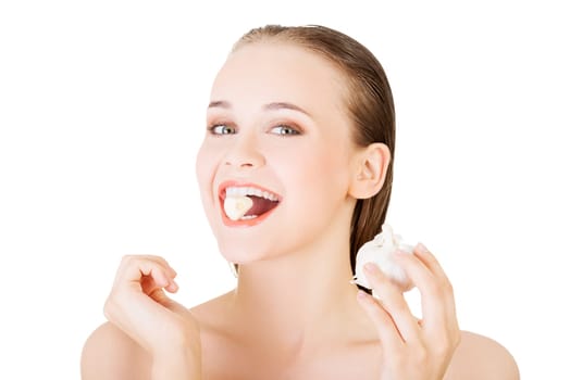 Young beautiful woman eating garlic. Healthy eating concept. Natural antibiotic that fight infection