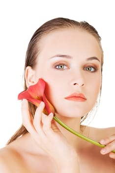 Beauty face of the young beautiful woman with flower. Girl on white background