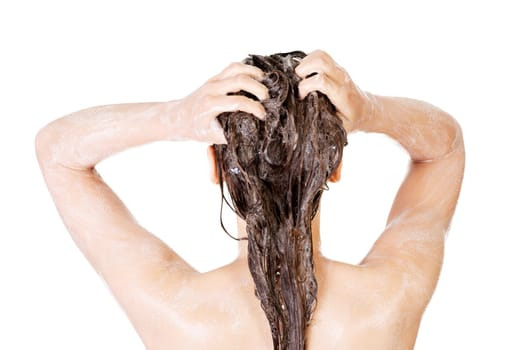Young fit woman in shower washing her body