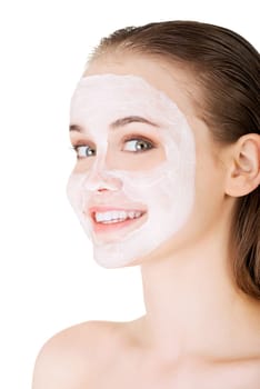Beautiful woman with clay facial mask, isolated on white