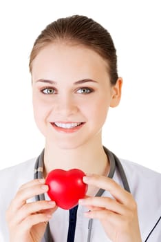 Female doctor holding red heart in hand. Isolated on white background