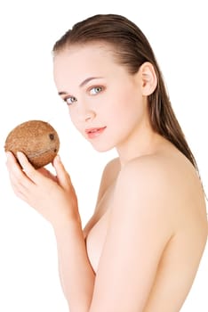 Beautiful woman with coconut in hands over white background