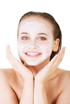 Beautiful woman with clay facial mask, isolated on white