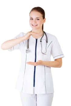 Medical doctor woman or nurse presenting and showing copy space for product or text, isolated on white background