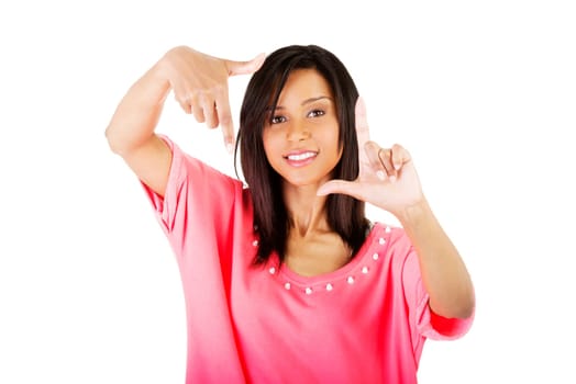 Smiling woman  is showing frame by hands. Happy girl with face in frame of palms. Isolated on white background.