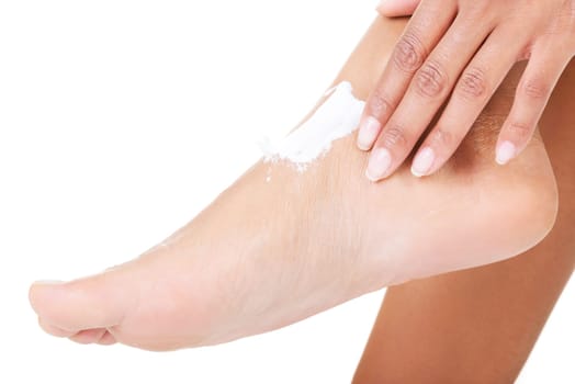 Female hands treating feet with moisturizing cream, isolated on white