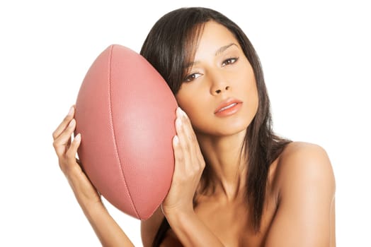Beautiful sexy woman with American football ball