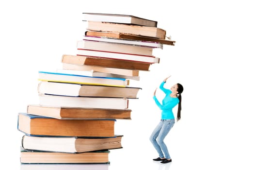 Student woman afraid of pile of books. Isolated on white background. Learning problem and exam concept.