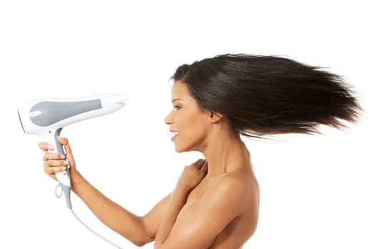 Woman with long hair holding strong blow dryer