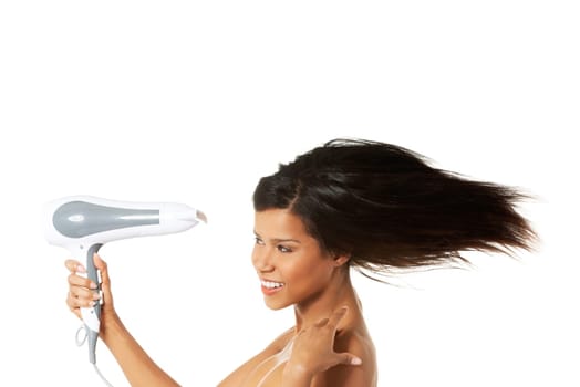 Woman with long hair holding strong blow dryer