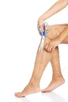 Legs pain concept - legs tied with rope