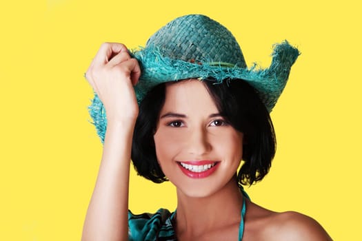 Happy summer woman over yellow background