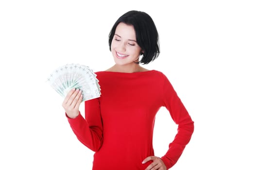 Cheerful young lady holding cash - polish zloty ( pln )