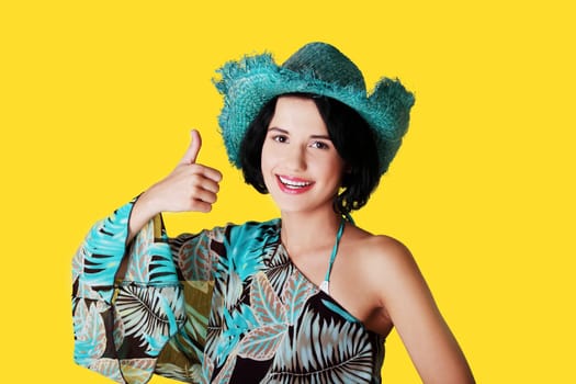 Happy summer woman over yellow background