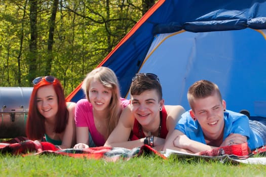 Young teenager group are having their holliday on a camping