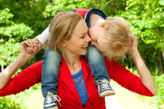 Happy mother and son having a nice day in the park