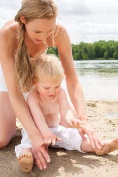 Happy mother and son having a nice day at the beach