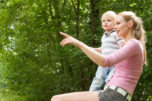 Happy mother and son having a nice day in the park