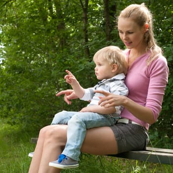 Happy mother and son having a nice day in the park