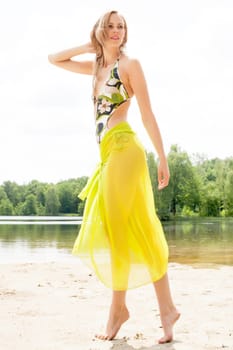 Beautifull model in bikini on the beach with sunny weather