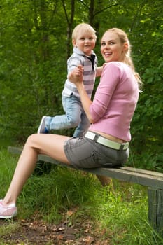 Happy mother and son having a nice day in the park