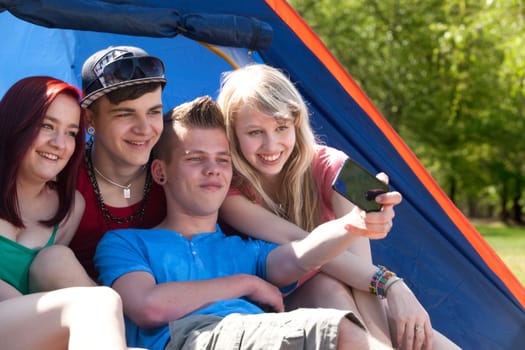 Young teeanger group are making the picture with a phone camera