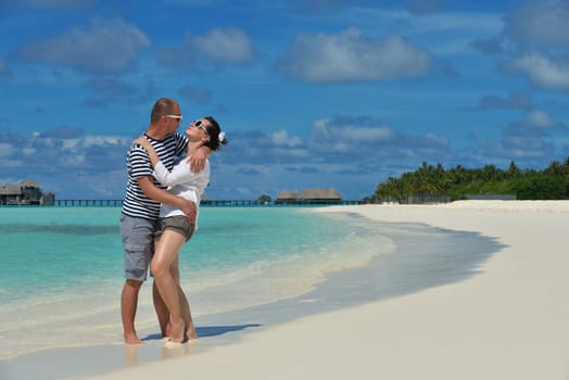 happy young couple relax and take fresh drink at summer vacation
