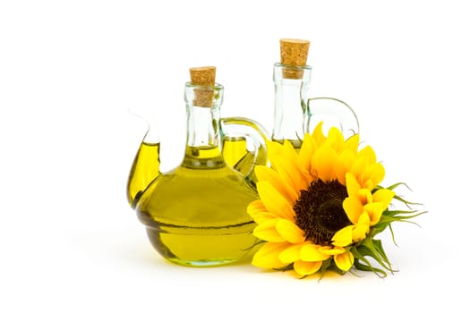 sunflower oil and sunflowers isolated on white background