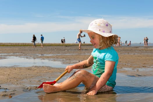 girl is playing at low water