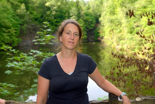 woman in front of nature- background