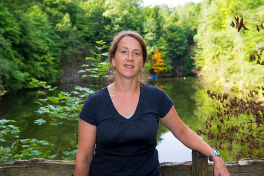woman in front of nature- background