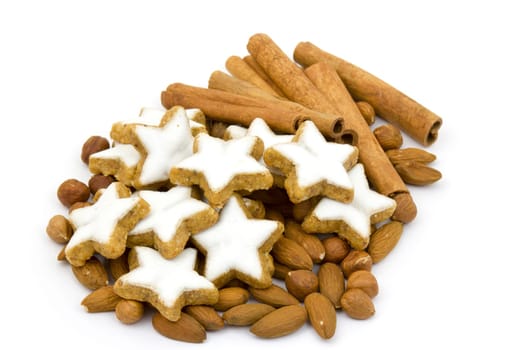 typical christmas cinnamon star cookies, nuts and cinnamon sticks