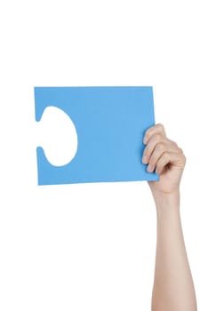 Hand Holding a Blue Piece of a Puzzle With Copyspace, Isolated
