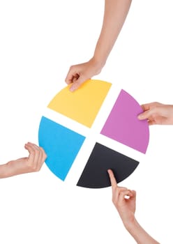 Four Hands Holding Colorful Pieces of a Chromatic Circle, Isolated