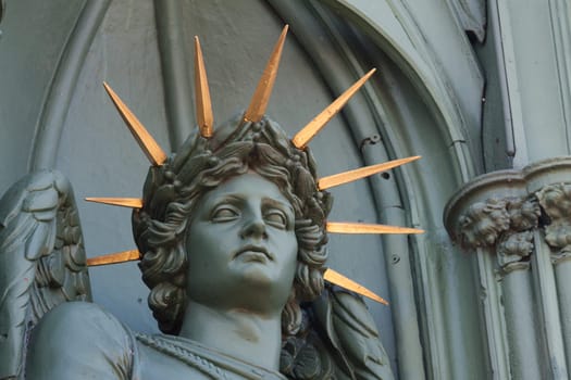 Angel figure with radiant crown