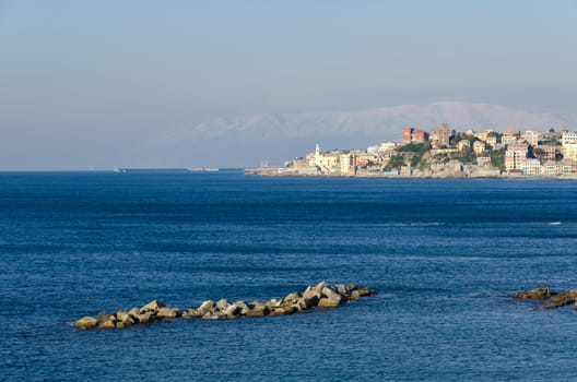 boccadasse with snowy mountains in Genoa
