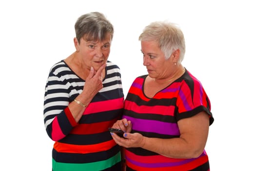 Two senior citizens with mobile phones - cropped on a white background