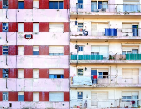 Facades of two poor apartment buildings in La Boca neighborhood of Buenos Aires